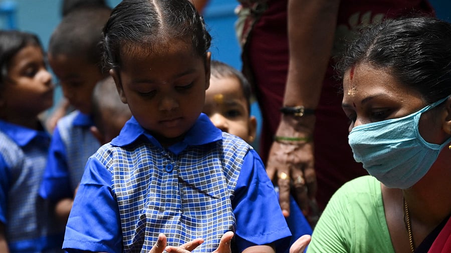 The committee, headed by MLC V S Sankanur, submitted the report to Primary and Secondary Education Minister B C Nagesh. Credit: AFP Photo