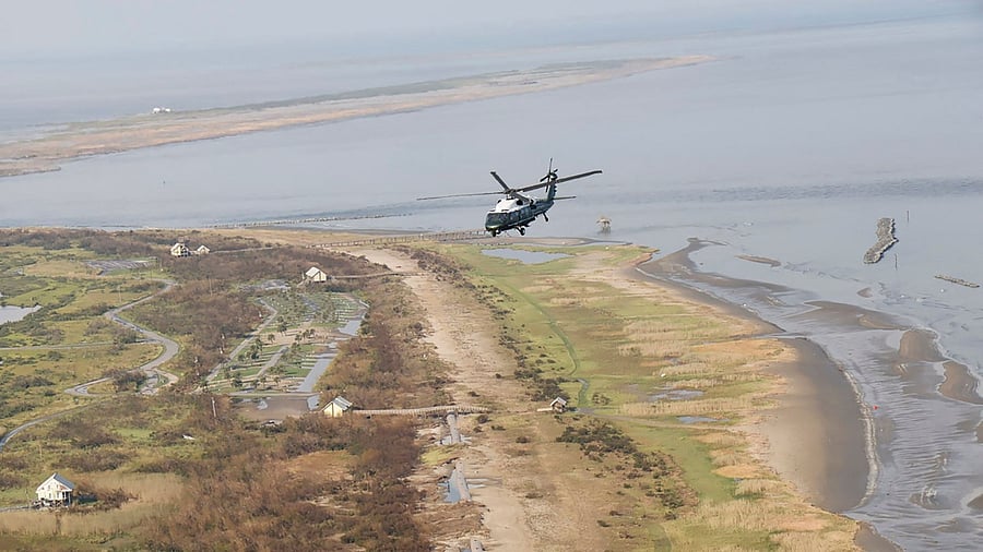 US President Joe Biden, aboard the Marine One helicopter, inspects the damage from Hurricane Ida on an aerial tour of communities in Laffite, Grand Isle, Port Fourchon and Lafourche Parish, Louisiana, September 3, 2021. Credit: AFP Photo