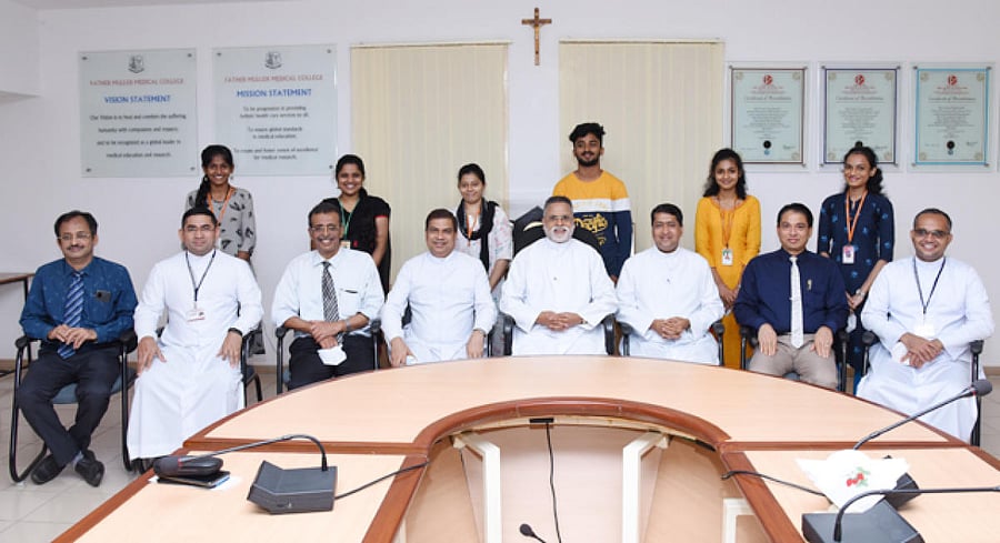 Father Muller Charitable Institutions director Fr Richard Aloysius Coelho with the students who won the scholarships on FMCI premises in Mangaluru on Friday.