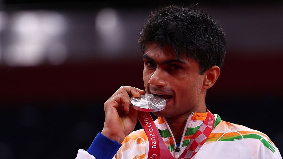 Silver medallist Suhas Lalinakere Yathiraj of India poses on the podium. Credit: Reuters Photo
