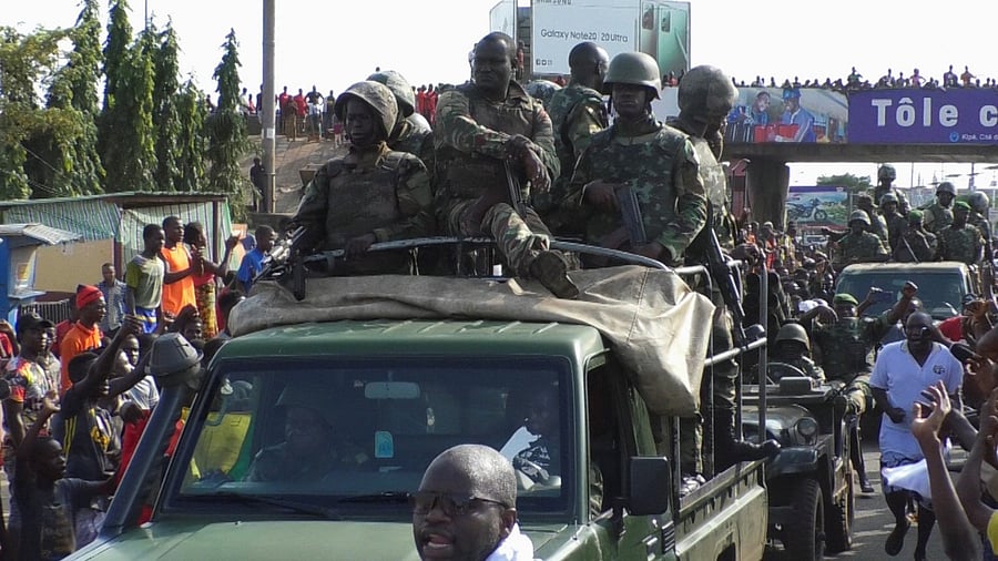 Residents cheer at army soldiers as they celebrate the uprising in Conakry. Credit: Reuters Photo