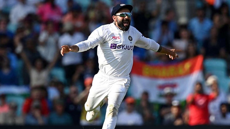 Virat Kohli reacts after England's James Anderson lost his wicket during play on the fifth day of the fourth cricket Test match between England and India at the Oval cricket ground in London. Credit: AFP Photo