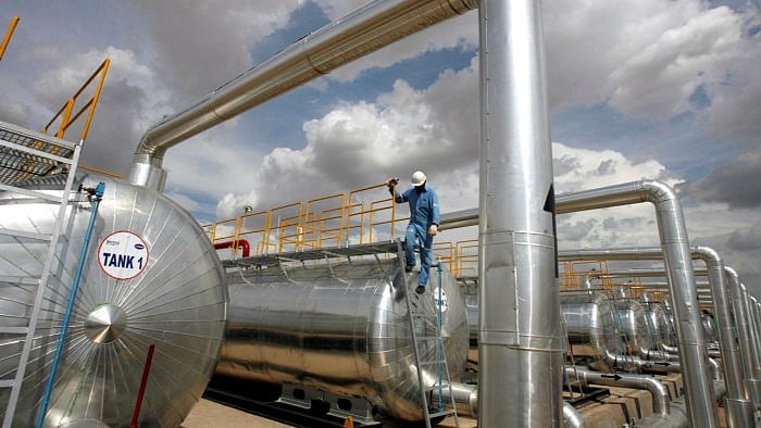 A Cairn India employee works at a storage facility for crude oil at Mangala oil field at Barmer in Rajasthan. Credit: Reuters file photo
