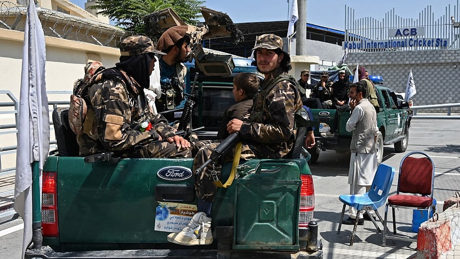 Taliban fighters patrol. Credit: AFP Photo