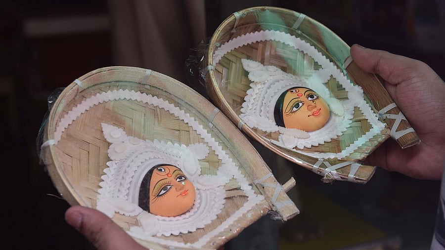 An artist shows idols of Goddess Durga ahead of the Durga Puja festival, in Kolkata. Credit: PTI File Photo