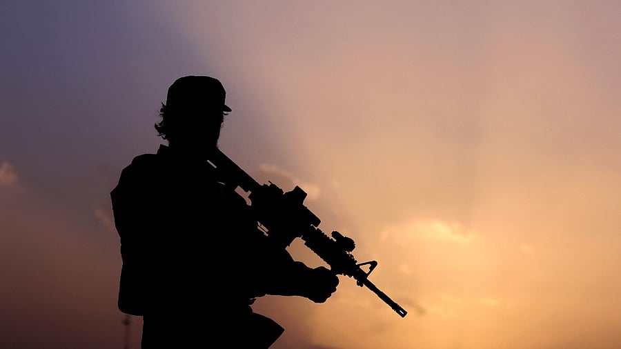 A Taliban fighter stands guard. Credit: AFP Photo
