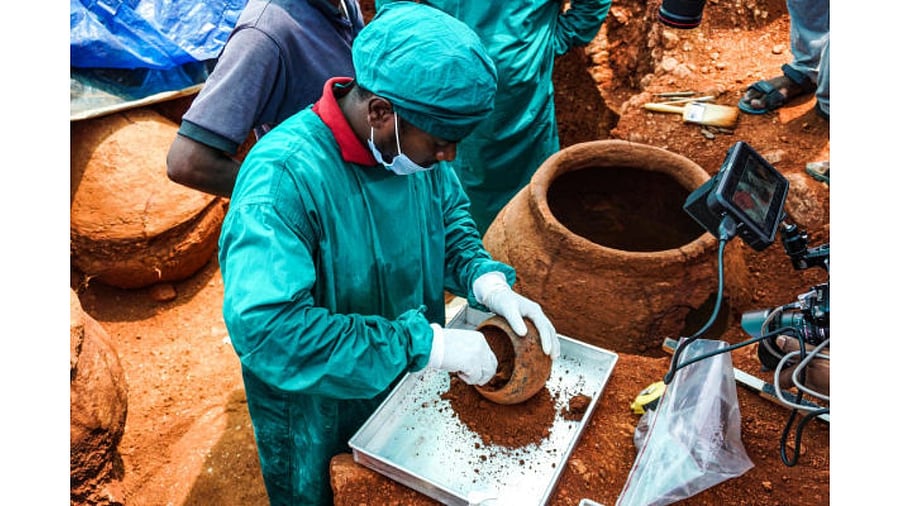 Samples being collected from an offering vessel found inside a burial urn in Sivagalai in Tamil Nadu. Credit: TNSDA