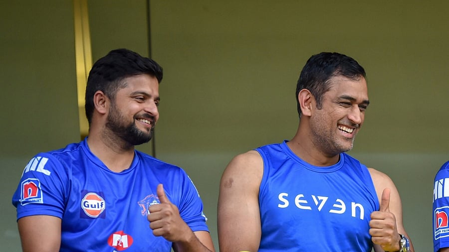 Suresh Raina (left) and Mahendra Singh Dhoni. Credit: PTI file photo
