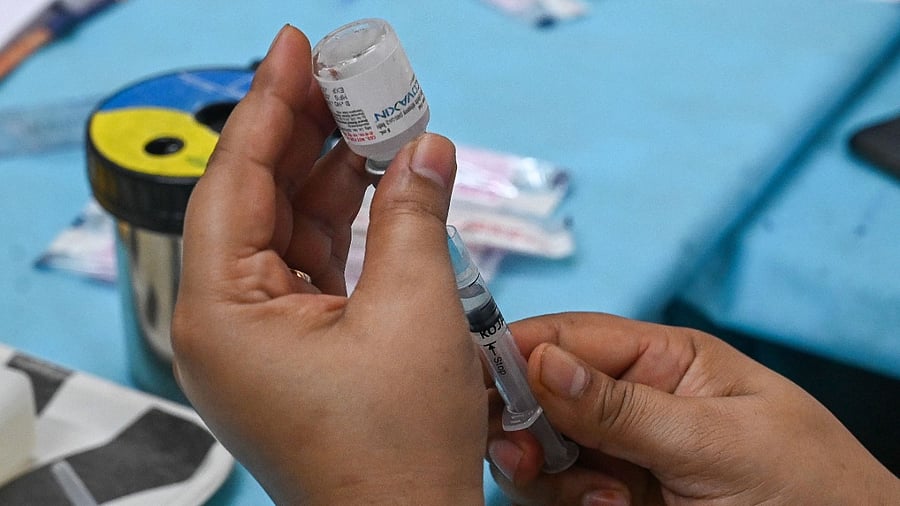 A health worker prepares a dose of Covaxin. Credit: AFP Photo