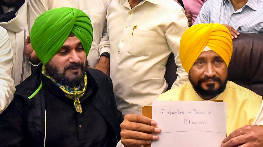 Navjot Singh Sidhu (L) and Charanjit Singh Channi. Credit: PTI Photo
