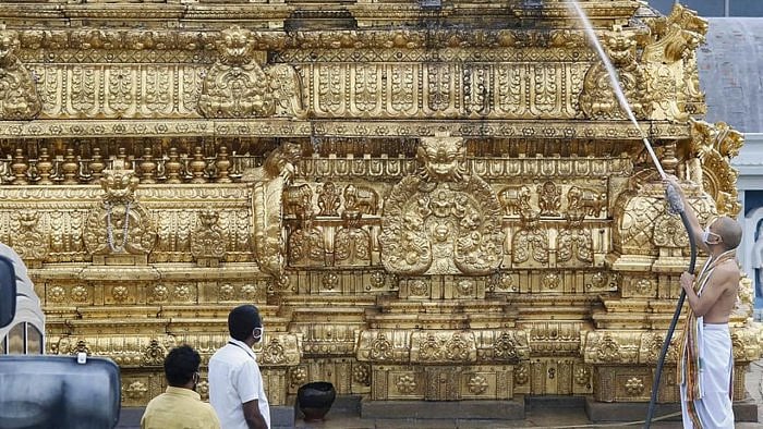 Devotees clean the Tirupati Balaji Temple. Credit: PTI Photo