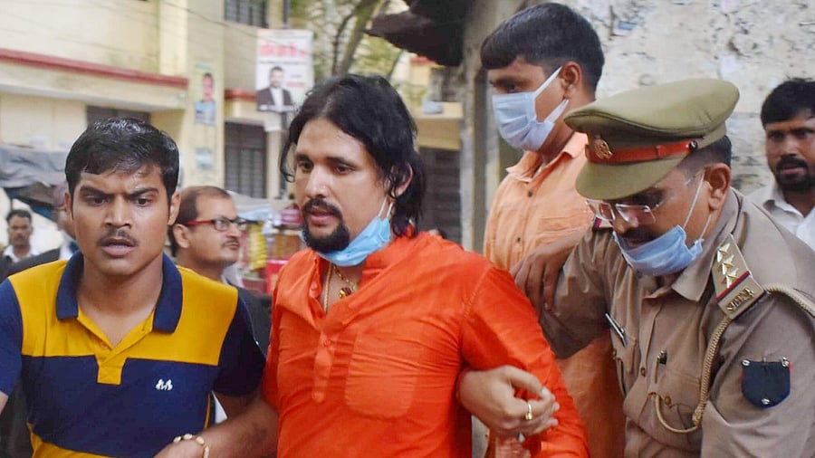 Swami Anand Giri, prime accused in Mahant Narendra Giri death case, being produced in the District Court, in Prayagraj, Wednesday, September 22, 2021. Credit: PTI Photo