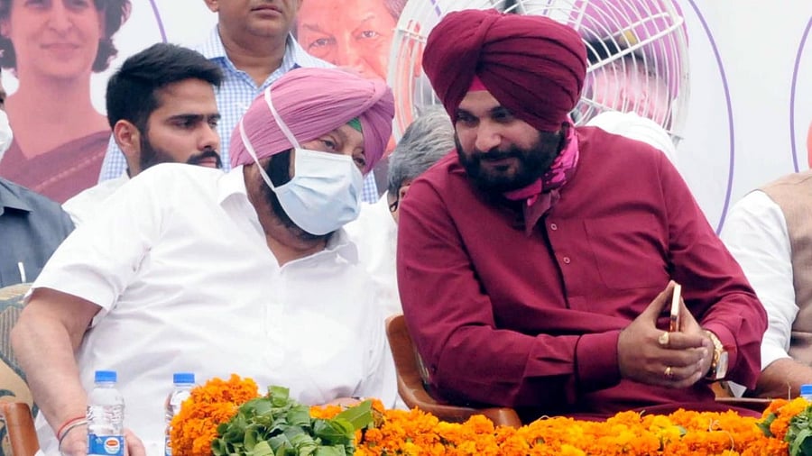 File Photo of former CM Amarinder Singh and Navjot Singh Sidhu. Credit: PTI Photo