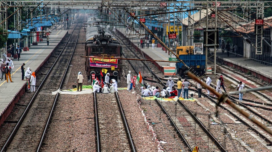 Farmers block railway tracks as part of protests against farm reforms during 'Bharat Bandh' protests, at Sonipat Railway Station, Haryana, Monday. Credit: PTI Photo