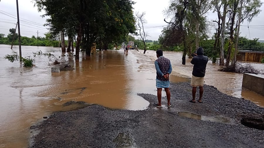 Water flows above a bridge near Kanchanal village in Kalagi taluk of Kalaburagi district on Tuesday. Credit: Special arrangement