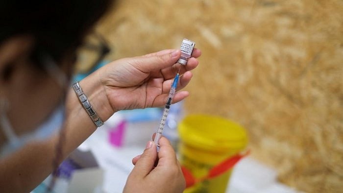 Healthcare worker prepares Covid-19 vaccine. Credit Reuters Photo