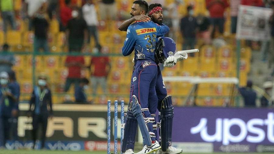 Hardik Pandya and Krunal Pandya of Mumbai Indians greet each other after the Indian Premier League match between Mumbai Indians and Punjab Kings, at the Sheikh Zayed Stadium, Abu Dhabi in the United Arab Emirates, Tuesday. Credit: PTI Photo