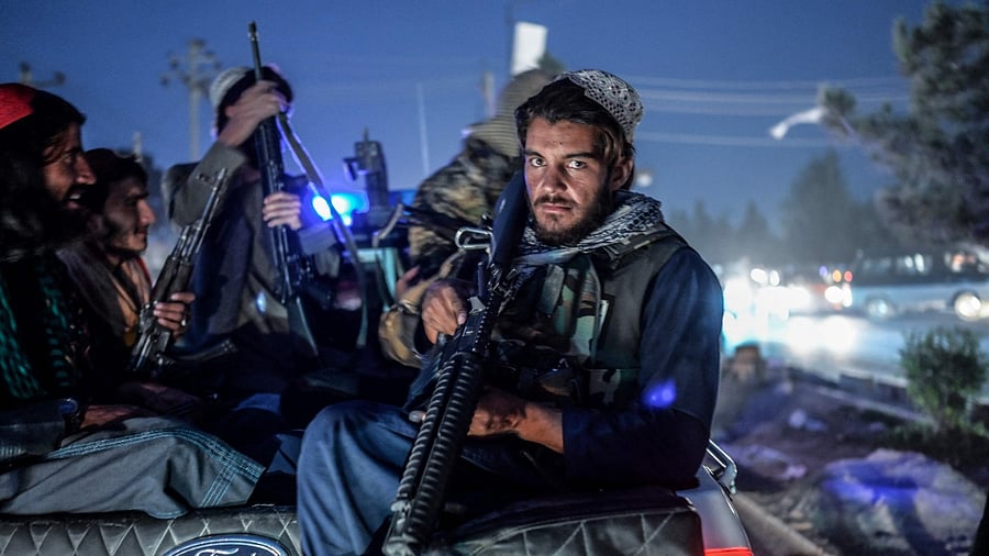 In recent weeks, the Taliban abandoned their traditional, civilian dress and donned military fatigues to project an air of authority. Credit: AFP Photo