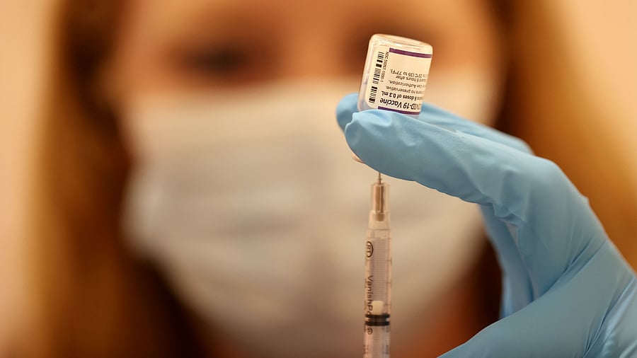 Safeway pharmacist Ashley McGee fills a syringe with the Pfizer Covid-19 booster vaccination. Credit: AFP Photo