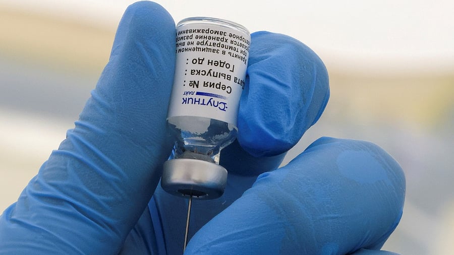 A healthcare worker fills a syringe with the one-dose Sputnik Light vaccine. Credit: Reuters File Photo