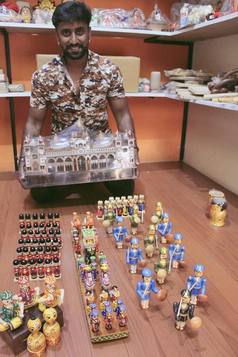 Kishore Gowda, owner of Bommbe_0114, a store on Magadi Road, Dasarahalli, has a palace darbar and procession set, which includes the police band and soldiers.