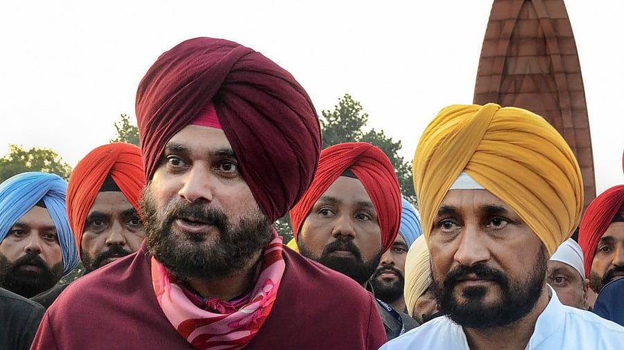 Navjot Singh Sindhu and Charanjit Singh Channi (R). Credit: PTI Photo