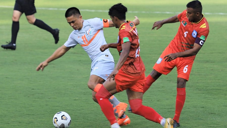 Indian football team captain Sunil Chhetri in action against Bangladeshi players during their World Cup qualifier match held in Qatar. Credit: AIFF via PTI