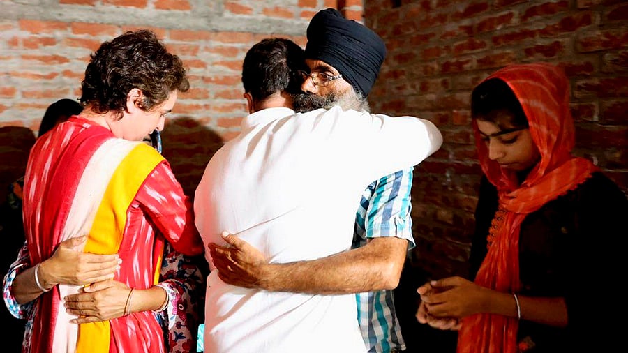 Congress leaders Rahul Gandhi and Priyanka Gandhi Vadra meet the family members of deceased farmer Lavpreet Singh in Lakhimpur Kheri. Credit: PTI Photo