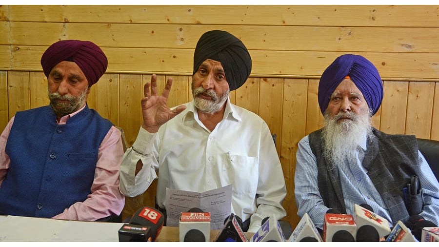 Gurdwara Parbandhak Committee Srinagar, President Navtej Singh along with committee executive members address a press conference regarding the killing of civilians including female Sikh school Principal by militants, in Srinagar. Credit: PTI Photo
