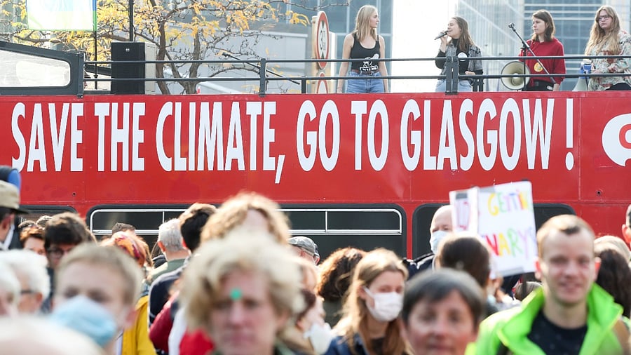 People take part in a Climate March ahead of the COP26 climate summit, in Brussels, Belgium October 10, 2021. Credit: Reuters Photo