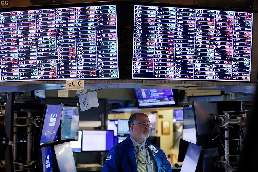 trader works on the floor at the New York Stock Exchange (NYSE) in Manhattan, New York City. Credit: Reuters Photo