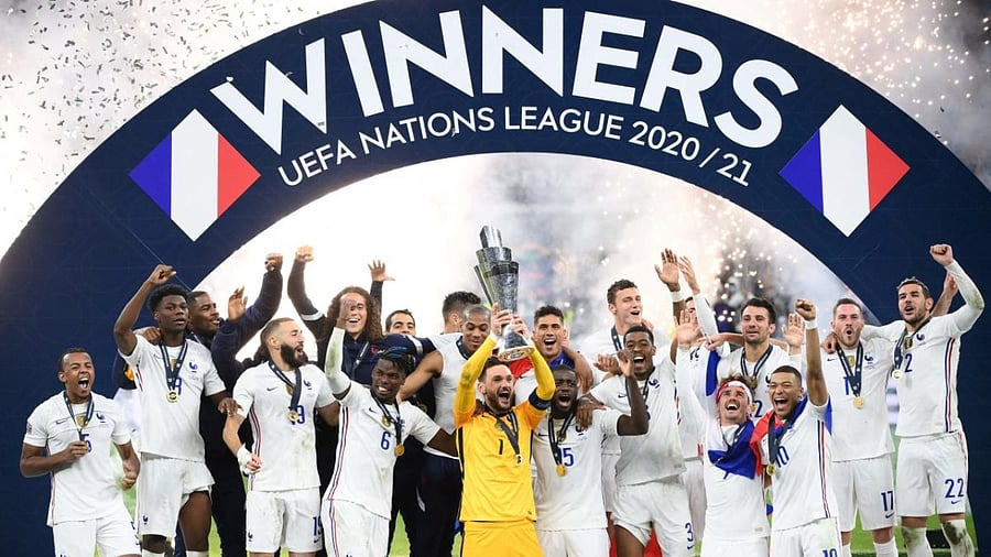 French players celebrate with the trophy at the end of the Nations League final football match between Spain and France at San Siro stadium in Milan. Credit: AFP Photo
