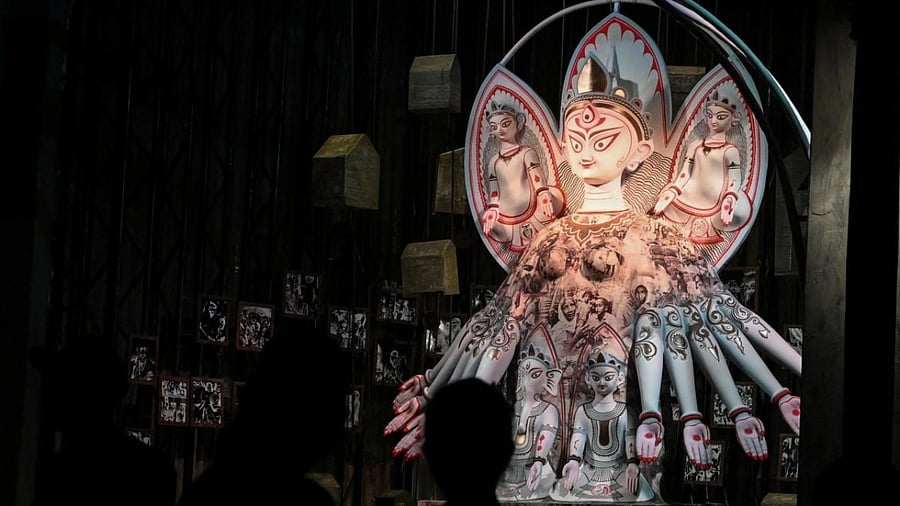 An idol of the Goddess Durga is seen on a makeshift place of worship. Credit: AFP Photo