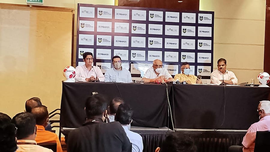The Kerala FA, Meeran Sports LLP and Scoreline Sports Pvt Ltd address a press conference. Credit: Twitter Photo