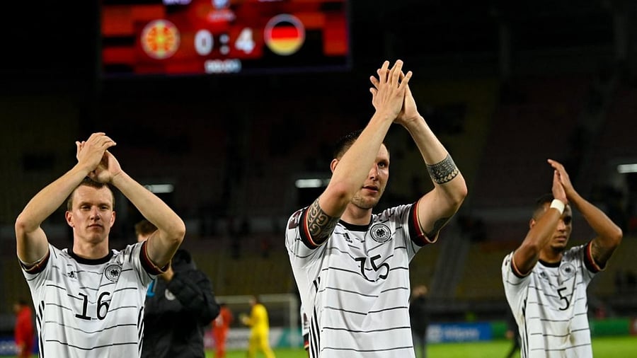 Germany's players celebrate their victory against North Macedonia during the FIFA World Cup Qatar 2022 qualification Group J football match between North Macedonia and Germany at the Toshe Proeski National Arena in Skopje. Credit: AFP Photo