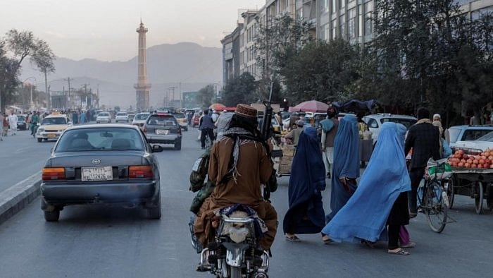 Members of the Taliban drive past a street in Kabul. Credit: Reuters File Photo