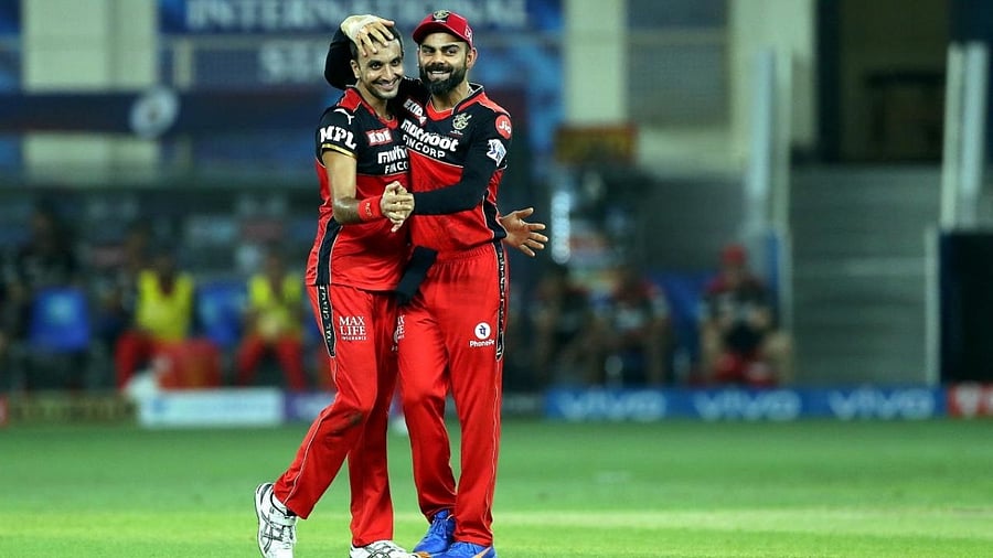 Harshal Patel (L) and Virat Kohli (R). Credit: PTI File Photo