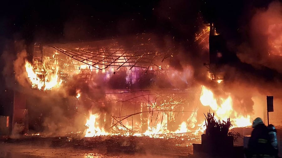Firefighters battling an overnight blaze that tore through a building in the southern Taiwanese city of Kaohsiung, killing at least 46 people and injuring dozens of others. Credit: AFP Photo