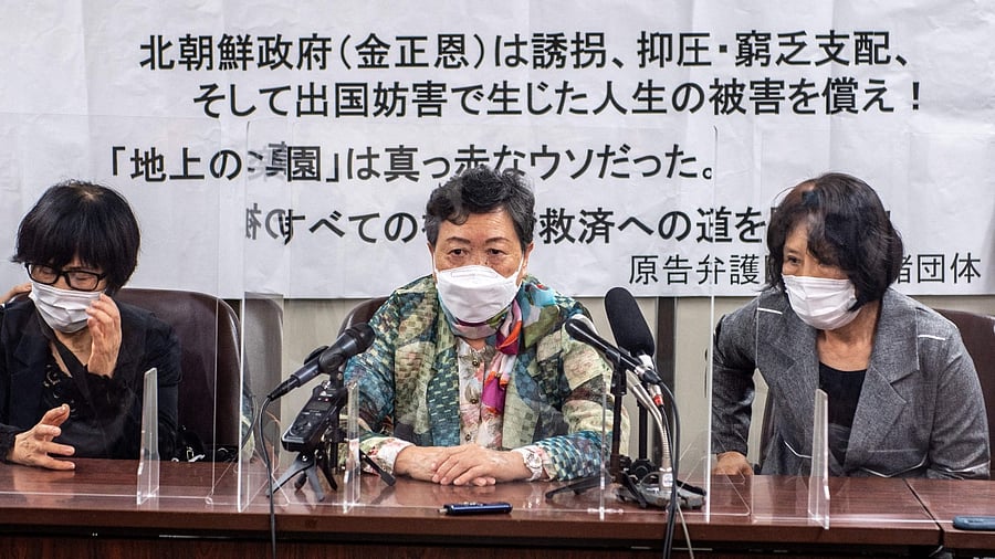 Eiko Kawasaki (C), is one of five plaintiffs in a case where North Korean defectors summoned Kim Jong Un to court over a repatriation programme they describe as 'state kidnapping'. Credit: AFP Photo