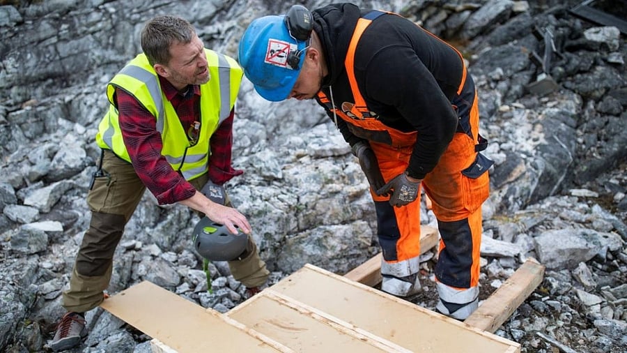 Geologist Anders Norby-Lie of the company Greenland Anorthosite Mining checks drilling cores at an exploration site of an anorthosite deposit close to the Qeqertarsuatsiaat fjord, Greenland. Credit: Reuters Photo