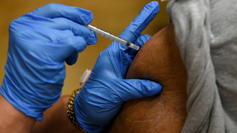 A person receives a vaccine for the coronavirus disease (COVID-19). Credit: Reuters Photo