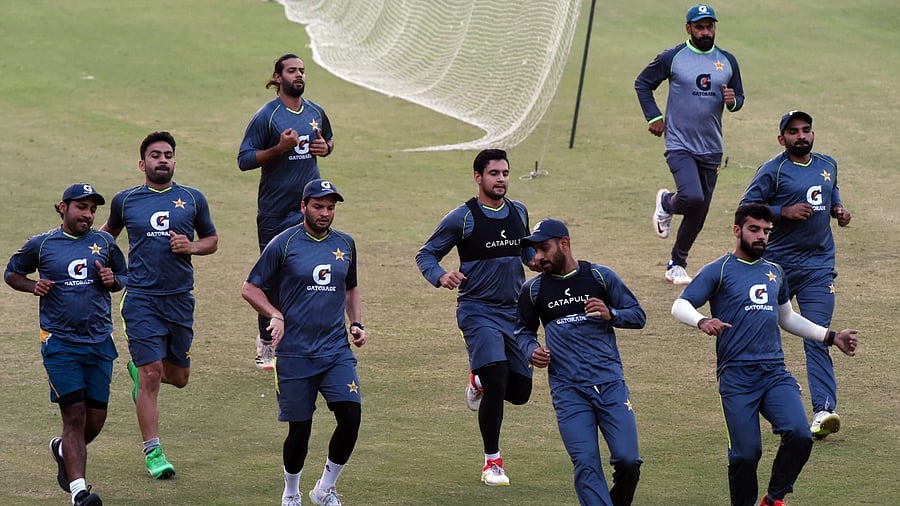 Pakistani cricketers warm up during a team practice session at the Gaddafi Cricket Stadium in Lahore. Credit: AFP File Photo