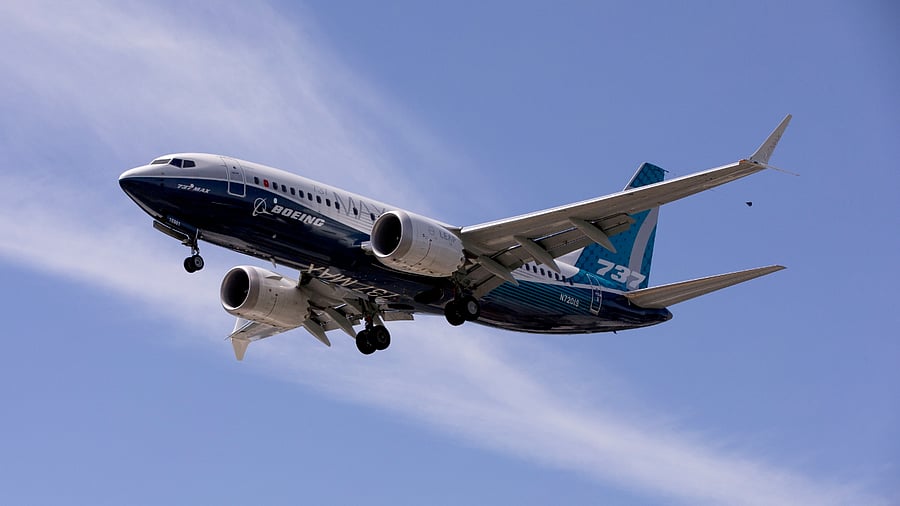A Boeing 737 MAX airplane lands after a test flight at Boeing Field in Seattle. Credit: Reuters Photo