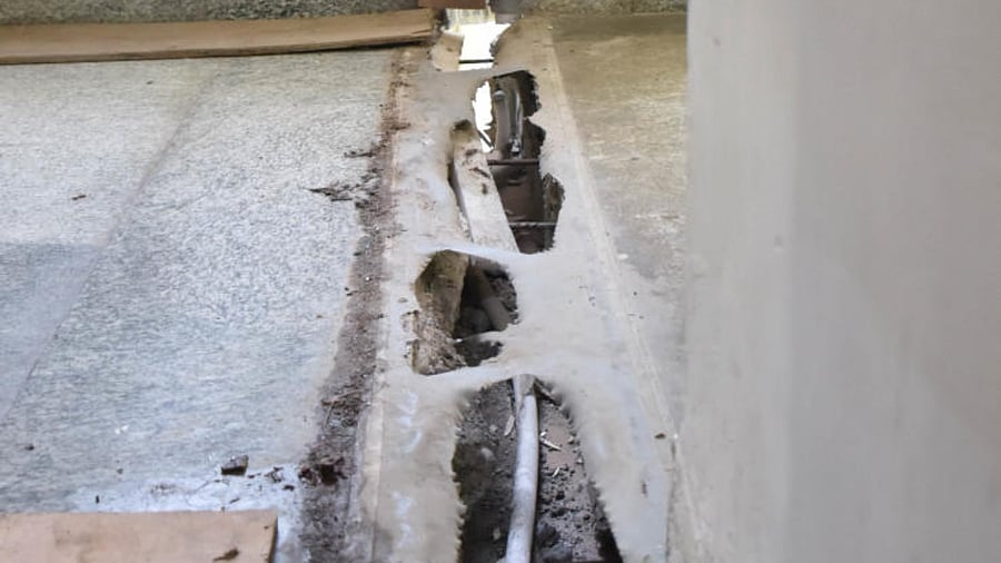 A crack that surfaced in the police quarters near Binny Mills, Bengaluru, on Saturday. Credit: DH Photo