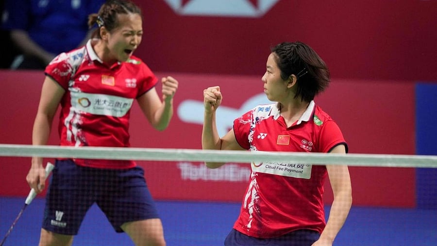 Chen Qing Chen and Jia Yi Fan (R). Credit: AFP File Photo