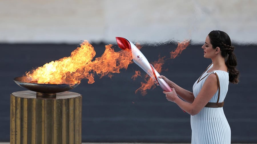 Flame handover ceremony in Athens for the Beijing 2022 Winter Olympics. Credit: Reuters Photo