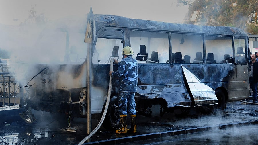 Two roadside bombs exploded near a bus carrying troops during the morning rush hour in the Syrian capital early Wednesday, killing and wounding several people, state TV reported. Credit: AP/PTI Photo