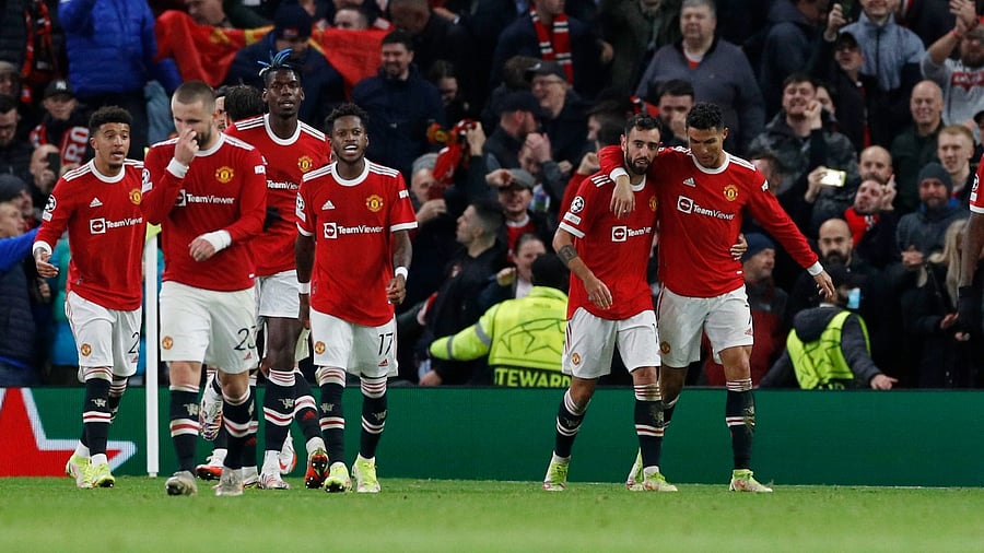 Manchester United's Cristiano Ronaldo celebrates scoring their winning goal against Atalanta with Bruno Fernandes. Credit: Reuters Photo