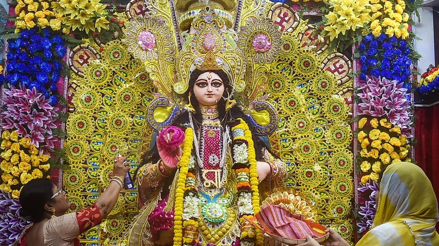 Idol of Goddess Lakshmi being worshipped at the residence of a Hindu devotee, in Kolkata. Credit: PTI Photo