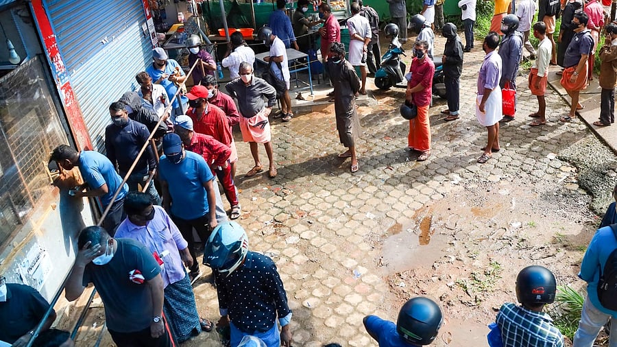 The court, on Thursday, said that in its 2017 judgement it had said that liquor outlets can be made walk-in to remove the queues outside them. Credit: PTI Photo